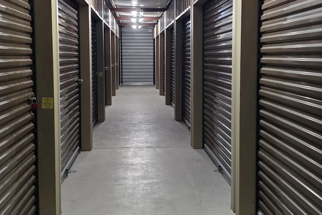 Climate-controlled indoor storage hallway with interior units at AAA Vault Storage