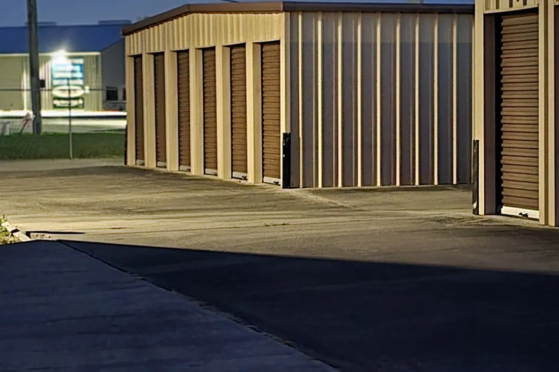 Open drive-up storage unit at dusk at AAA Vault Storage in Orange, TX